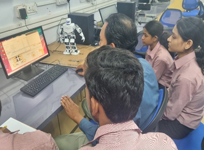 Students exploring a robotics project in the IoT laboratory